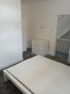Bright modern bedroom with ample storage space...