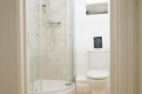 A modern and clean bathroom featuring a spaciou...