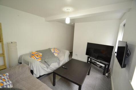 A cozy student living room featuring two sofas ...