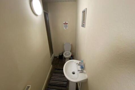 A clean and functional bathroom with a toilet a...