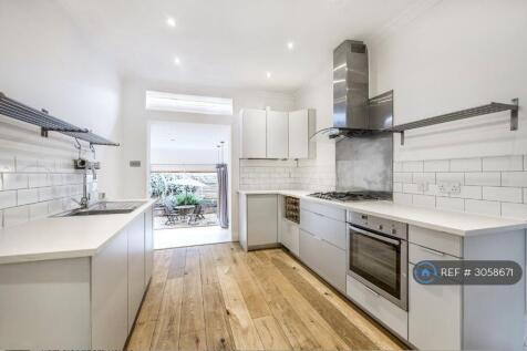 Open Plan Kitchen And Living Space Out To Garden