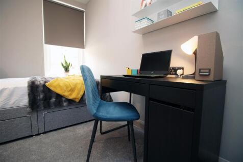 Modern study area with sleek desk and shelving...