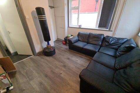 A spacious and comfortable living room with a m...