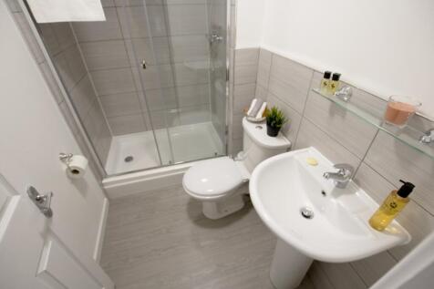 A clean and well-maintained bathroom with a spa...