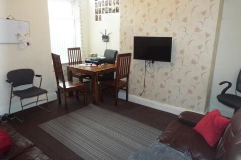 A cozy living room featuring a comfortable seat...
