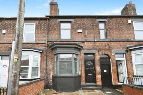 Brick-fronted terraced house with bay window an...