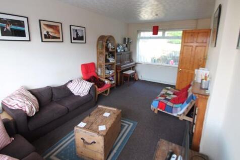 A cozy living room featuring a comfortable sofa...