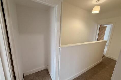 Bright and tidy landing with handy storage nook...