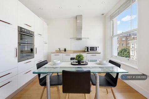 Sleek White Kitchen &amp; Dining Space
