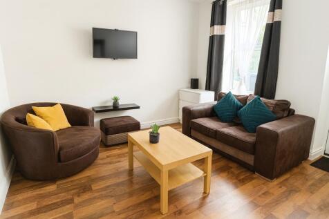 A bright, comfortable living room featuring a l...