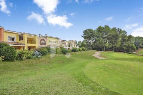 Landscaped fairways bordering the property in Moug