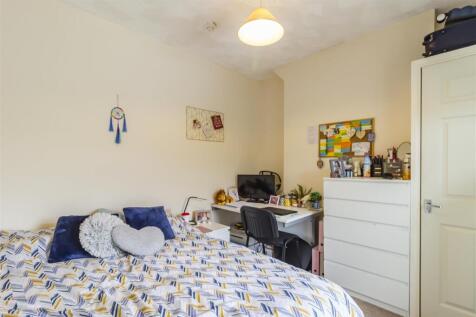 Bright bedroom with double bed and study desk...