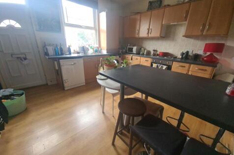 A bright and spacious living room featuring a l...