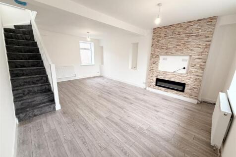 Bright, spacious living room with modern decor....