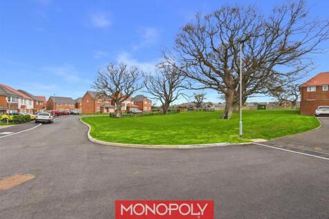 Nearby Play Area with a Fenced Pond
