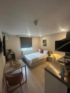 Bright, modern studio-style double bedroom with...