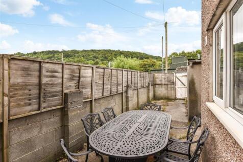 Private paved patio with social seating and vie...