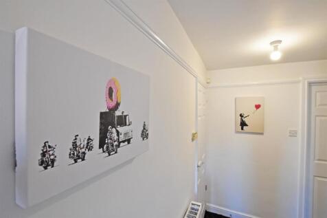 Bright hallway with modern art and clean finish...