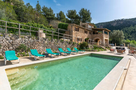 Pool area and exterior view of the finca