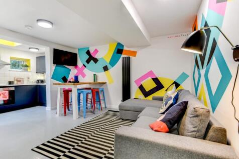 Bright, contemporary open-plan living area with...