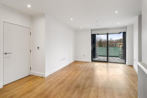 Experience the beauty of natural light streaming through the large windows of this modern apartment.
