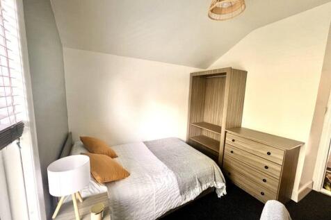 Bright and inviting double bedroom featuring a ...