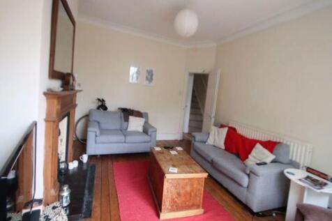 A spacious and inviting living room featuring t...