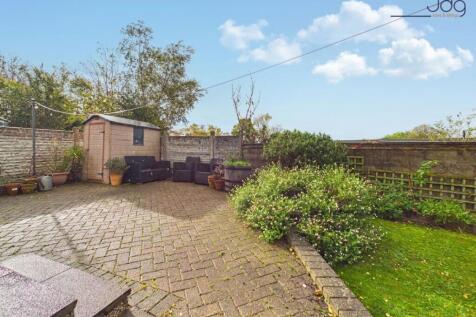 A Generous Wraparound Garden with Established Planting