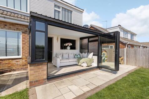 Conservatory With Bi-Fold Doors To Garden