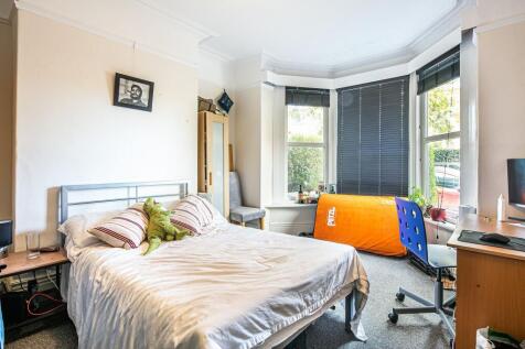 Bright, comfortable double bedroom with a large...