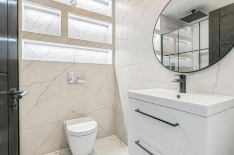 property in Grand Drive, 
Raynes Park, SW20