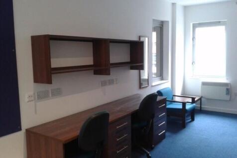 Bright study area with desks and seating...