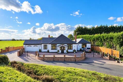 Countryside Bungalow with Wrought-Iron Gates.jpg