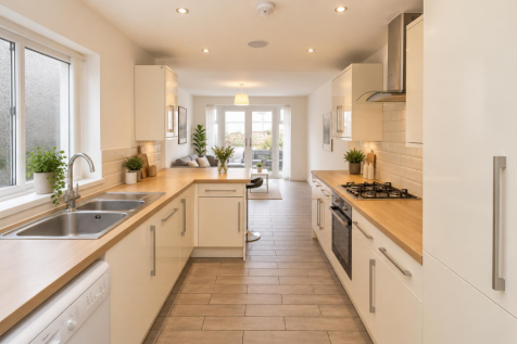 Bright Modern Galley Kitchen and Living Space.png