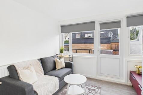 Bright, modern living room with a comfortable d...