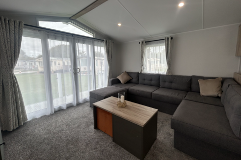 Spacious Lounge With Grey Corner Sofa, Coffee Tabl