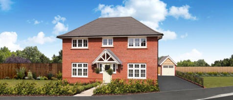 Modern red-brick house with white-framed windows, a front porch, and a driveway leading to a detache