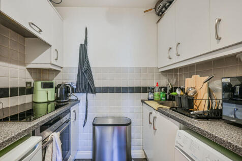 LONG LET. A bright and well-presented apartment offering stylish contemporary interiors, a generous reception room and residents' parking, set within a well-maintained development in a convenient resi