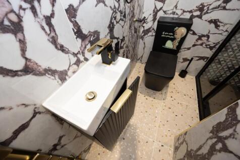 A stylish and modern bathroom with elegant marb...