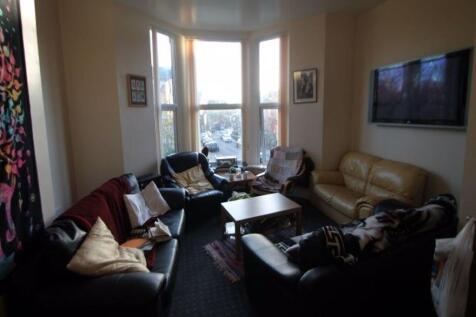 A cozy and inviting living room featuring a lar...
