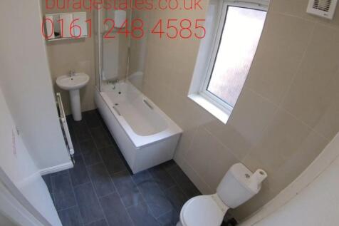 Bright and modern bathroom suite with bathtub...
