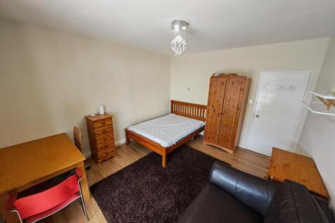 Spacious bedroom with double bed and desk space...