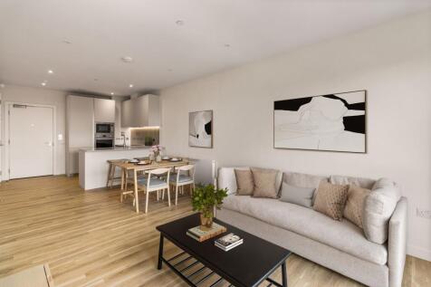 Experience the elegance of a stylish living area blended seamlessly with a modern kitchen.