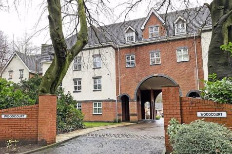 Elegant brick facade with charming archway entr...
