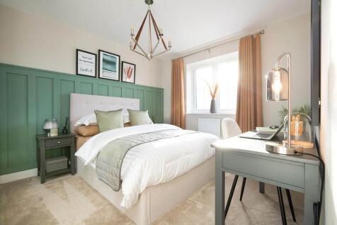 A second double bedroom offers space for older children or guests