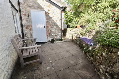 Rear courtyard with access to utility room and gar