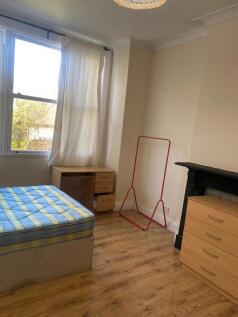 Bright bedroom with desk and ample storage...