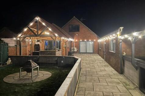 GREYSTONES NIGHT PATIO.jpg