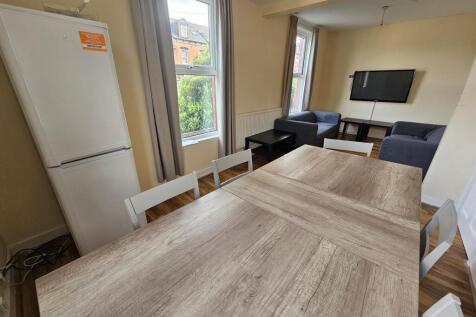 A bright and inviting living room featuring a l...