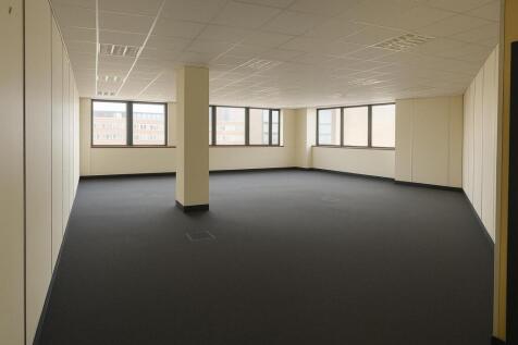 Spacious, bright open-plan workspace with large...